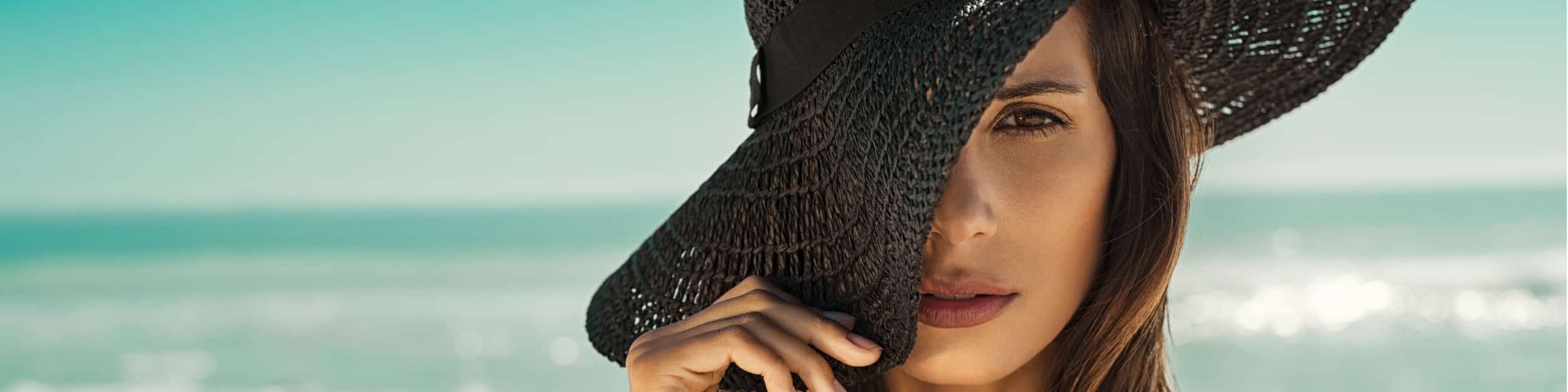 fashion woman with straw hat at beach picture id928867062 Fresno