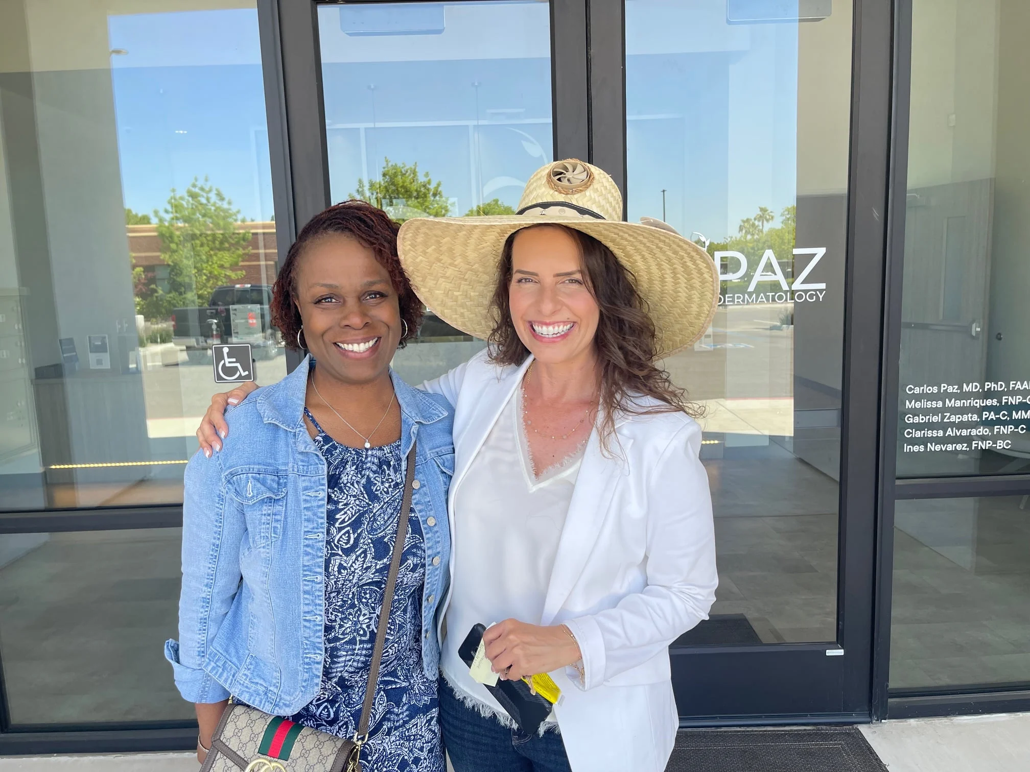 Dr. Vernice Nellon, President of Kool Breeze Solar Hats, in a wide-brim solar hat with patient Tamara White outside the Paz Dermatology office