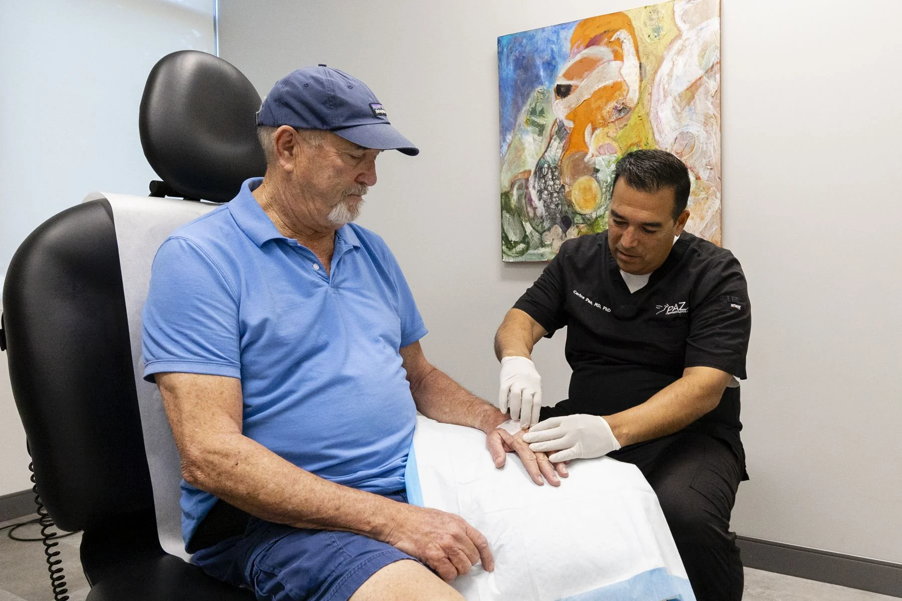 Dr. Paz talking with a patient during an exam