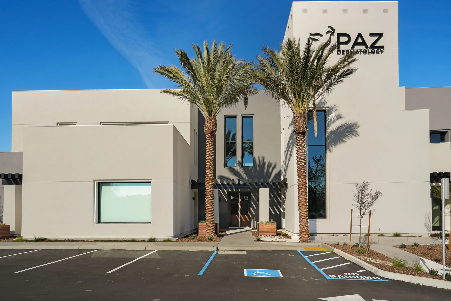 The Visalia entrance between palms