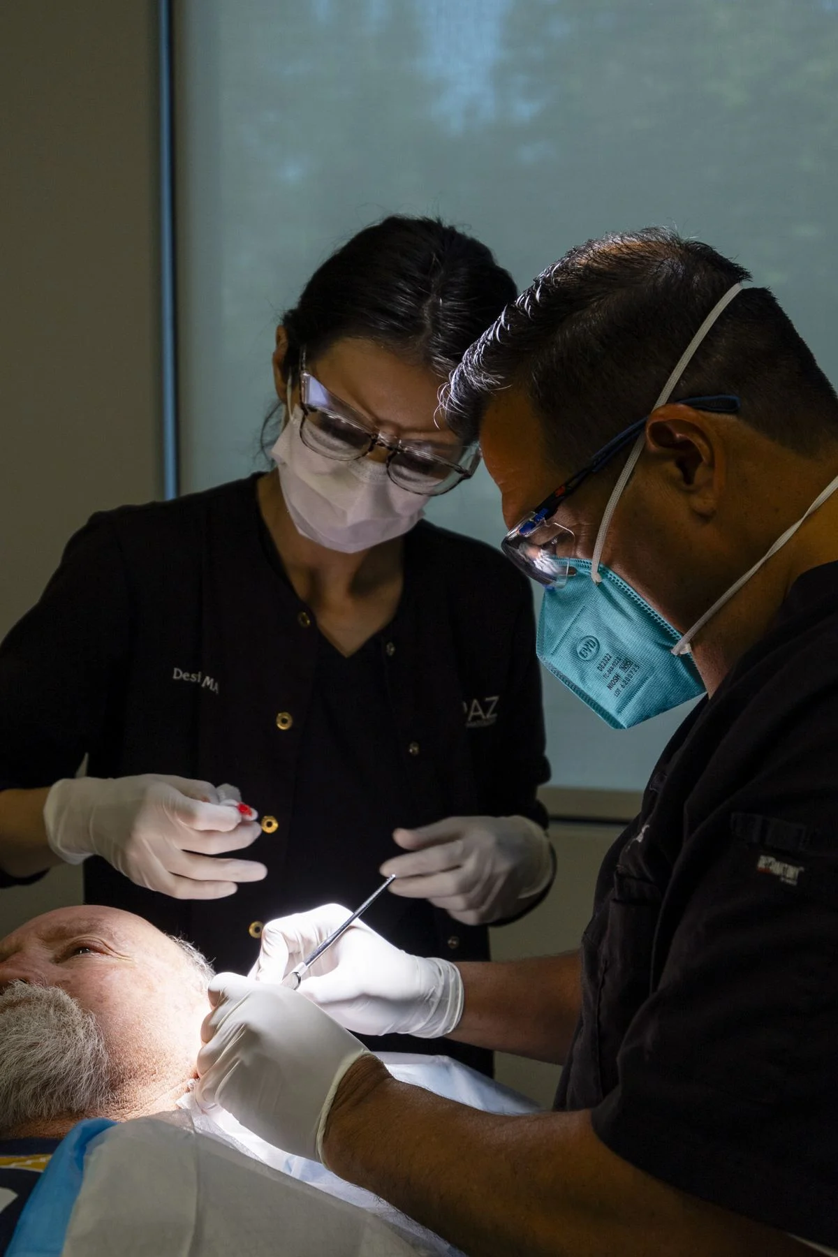 Dr. Carlos Paz, MD, PhD, in black scrubs